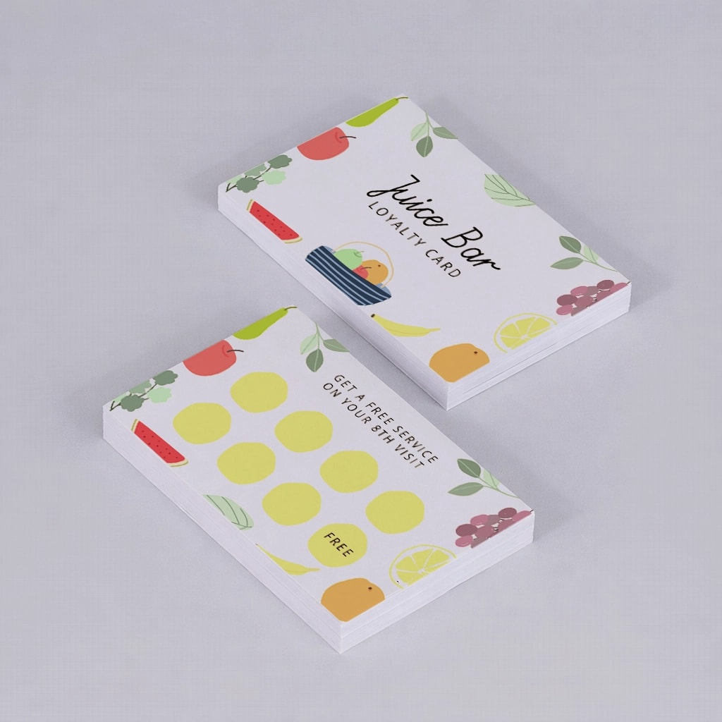 Two stacks of Juice Bar loyalty cards with colourful fruit illustrations on a light background.