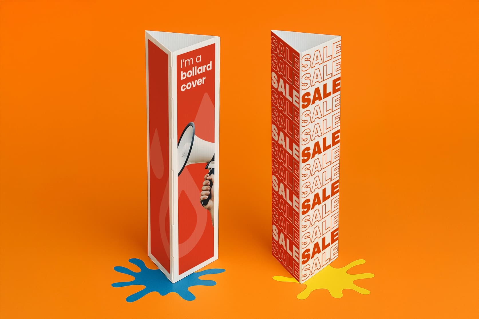 Two triangular bollard covers with bold designs stand on an orange surface with blue and yellow splats.