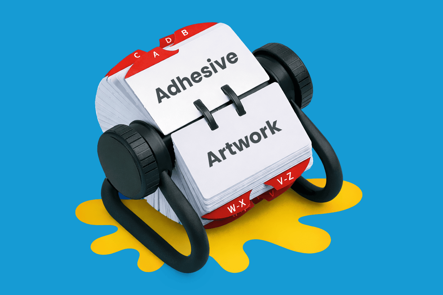 A Rolodex displaying cards labeled "Adhesive" and "Artwork" on a yellow paint splatter.