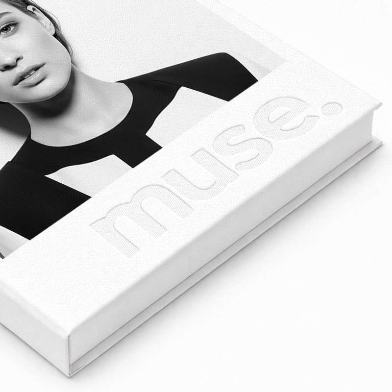 A white book titled "muse." with a black and white photo of a woman on the cover.