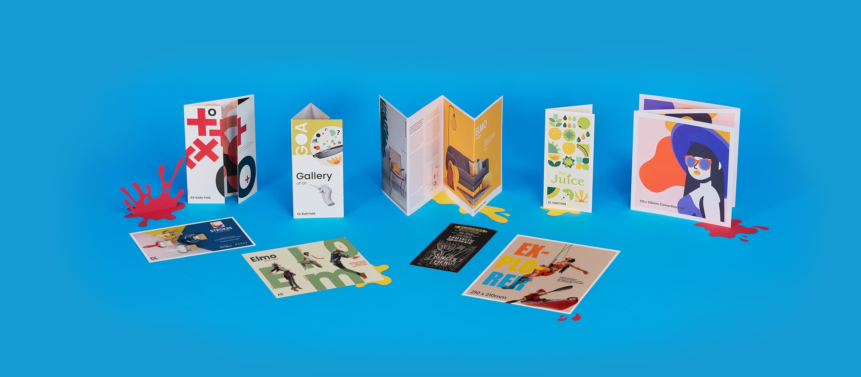 colourful brochures and cards displayed on a blue background.