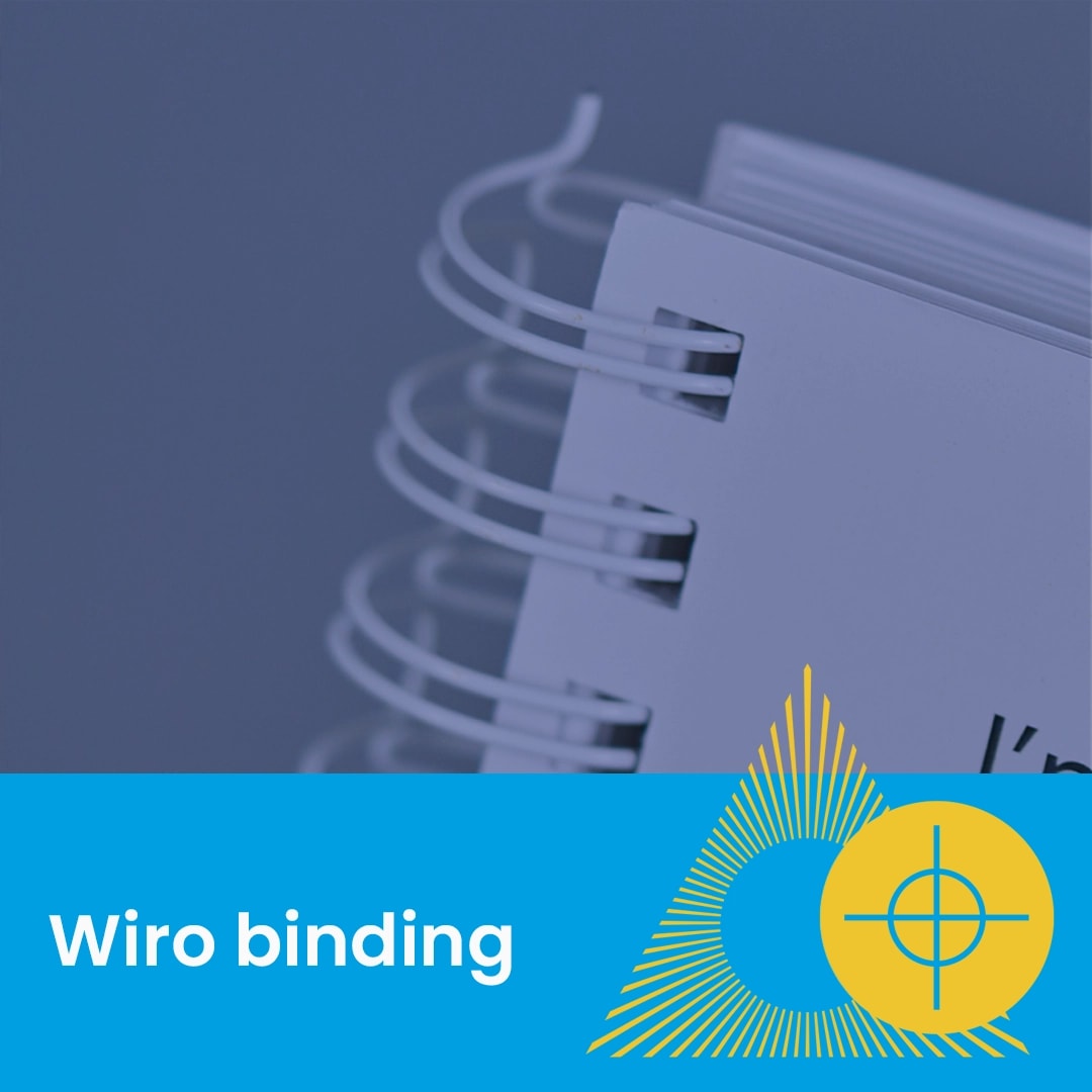 Close-up of white wiro binding on a stack of papers with blue and yellow graphic elements.